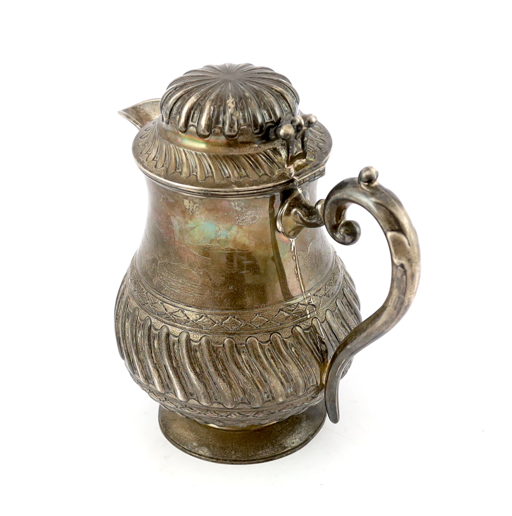 A late Victorian demi fluted wrythened silver water jug, by Mappin & Webb